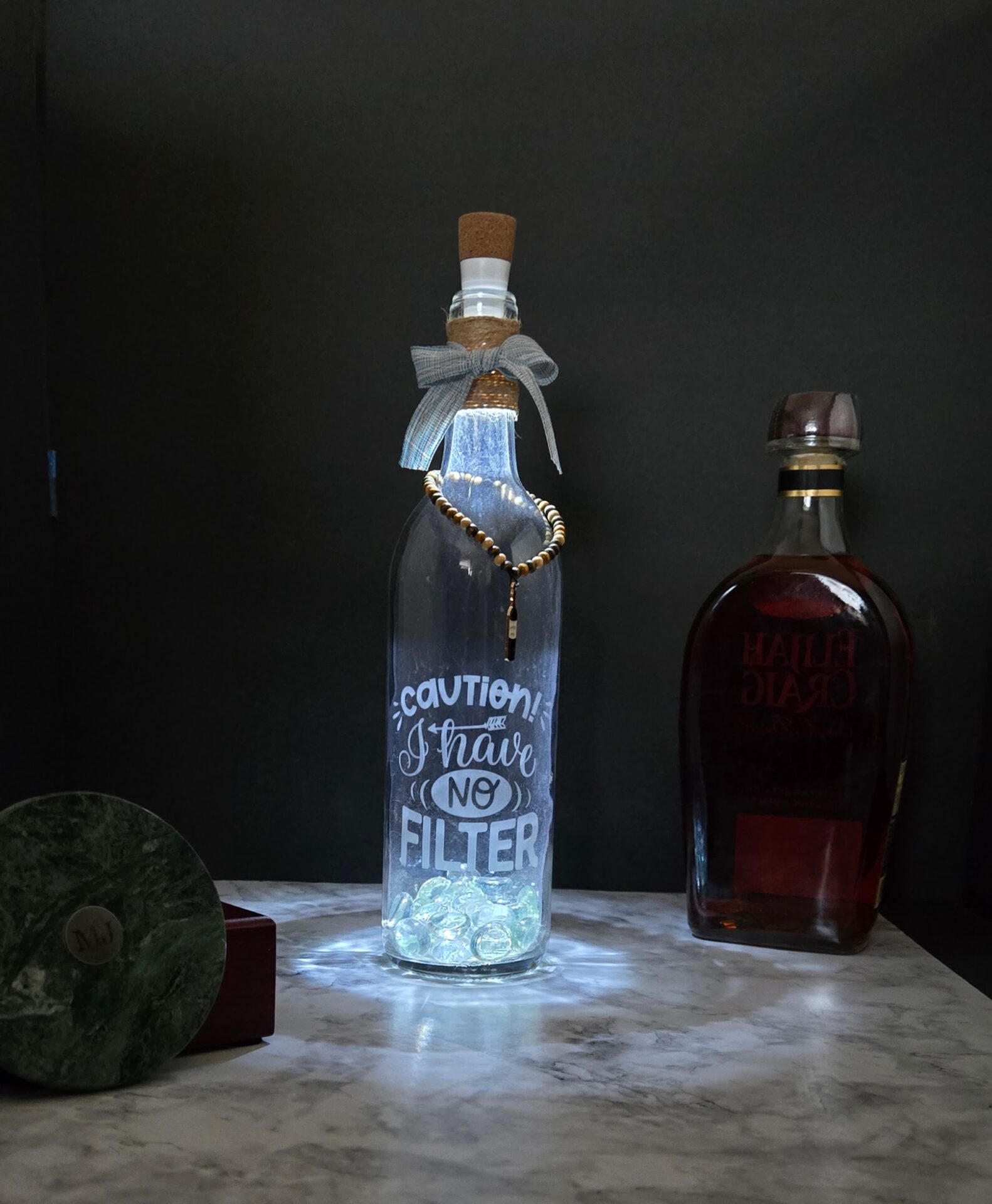 laser etched upcycled bottle; caution, i have no filter