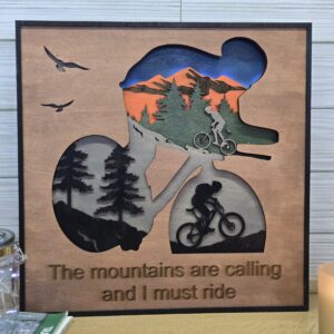 Laser Cut Layered Wood Art – “The Mountains Are Calling” Mountain Biking Wall Decor | Handmade 3D Wooden Shadow Box